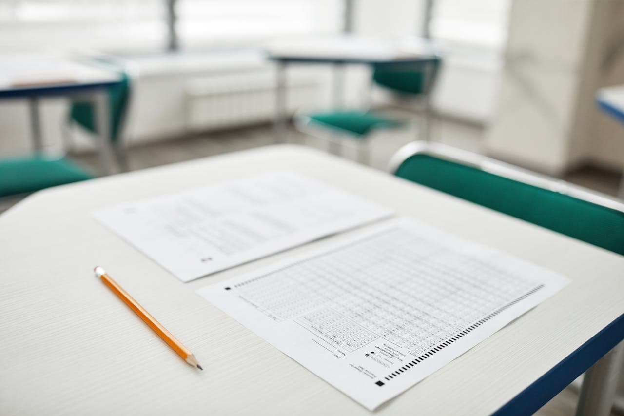 A test paper and pencil resting on a desk